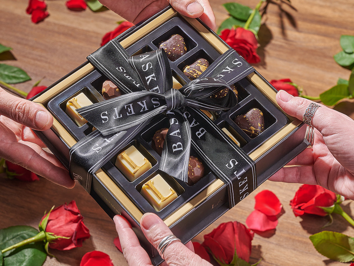 A beautifully wrapped chocolate gift box with roses.