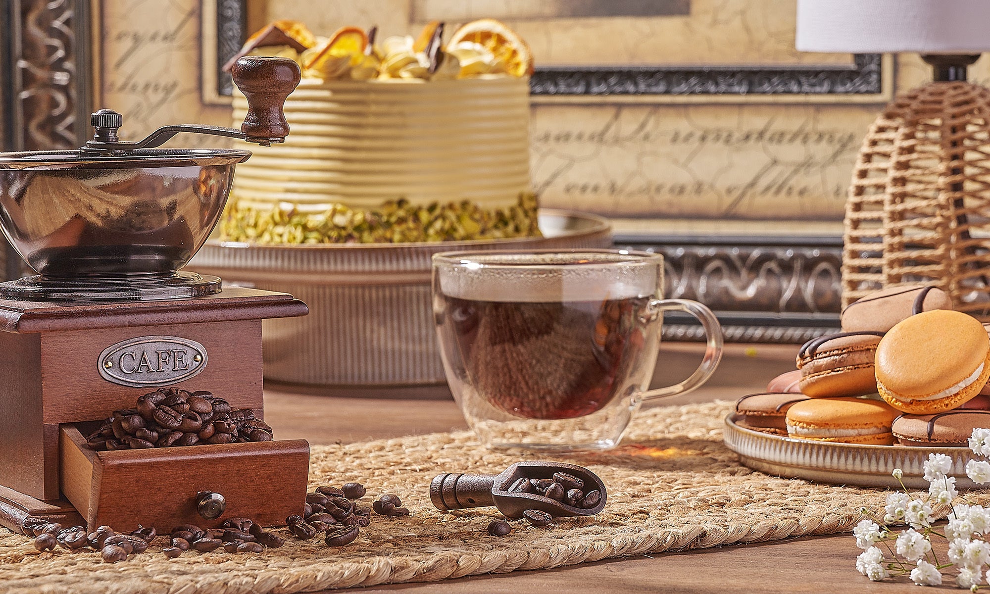 A cozy arrangement of coffee, pastries, and a grinder.